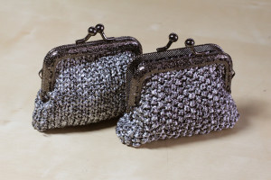 Coin purses. I've had this ball of ribbon yarn I never knew what to do with and finally settled on coin purses. 1 ball used.